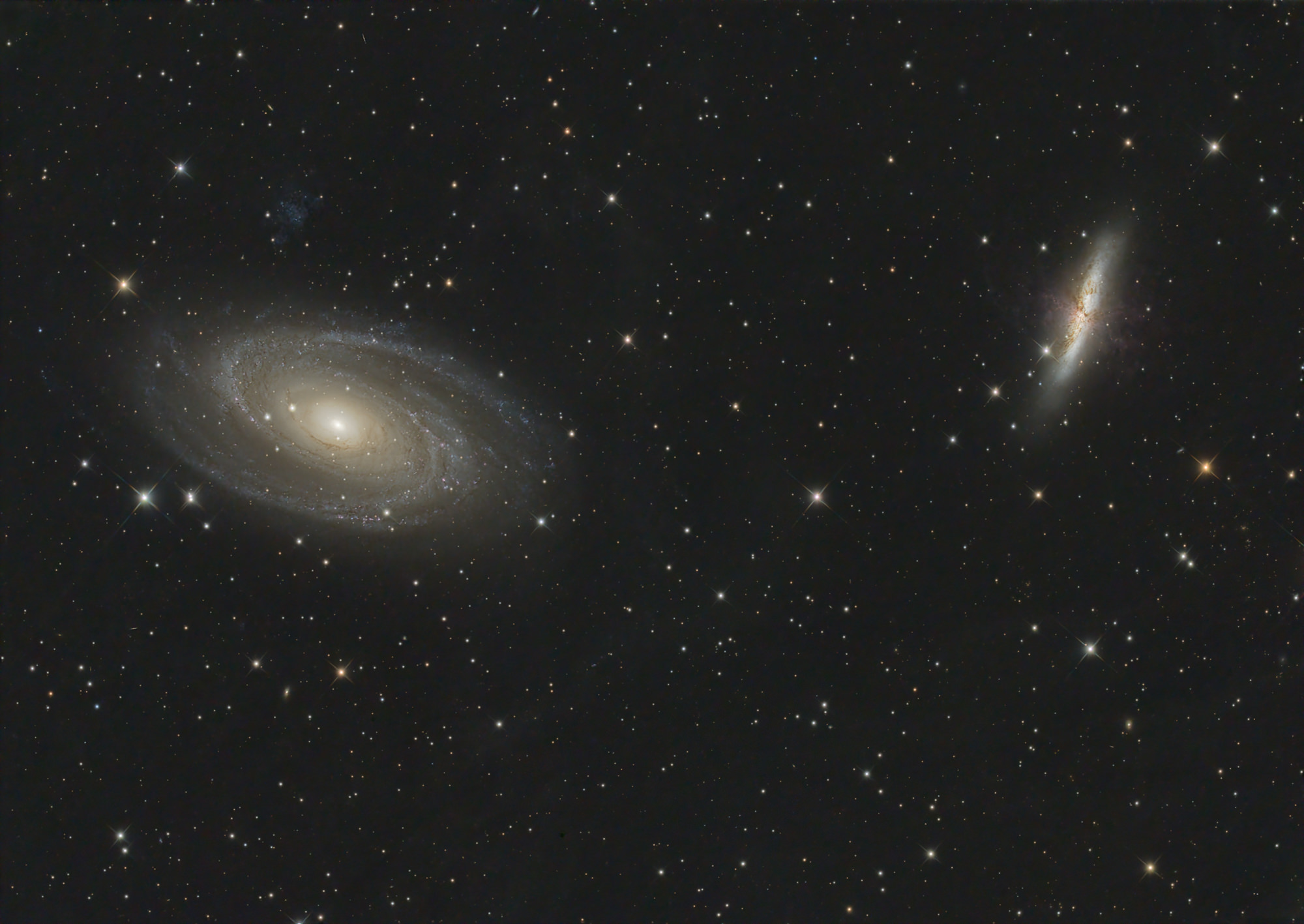 Messier 81 or Bode's Galaxy and the right galaxy Messier 82 or Cigar Galaxy and lie in the constellation Ursa Major.